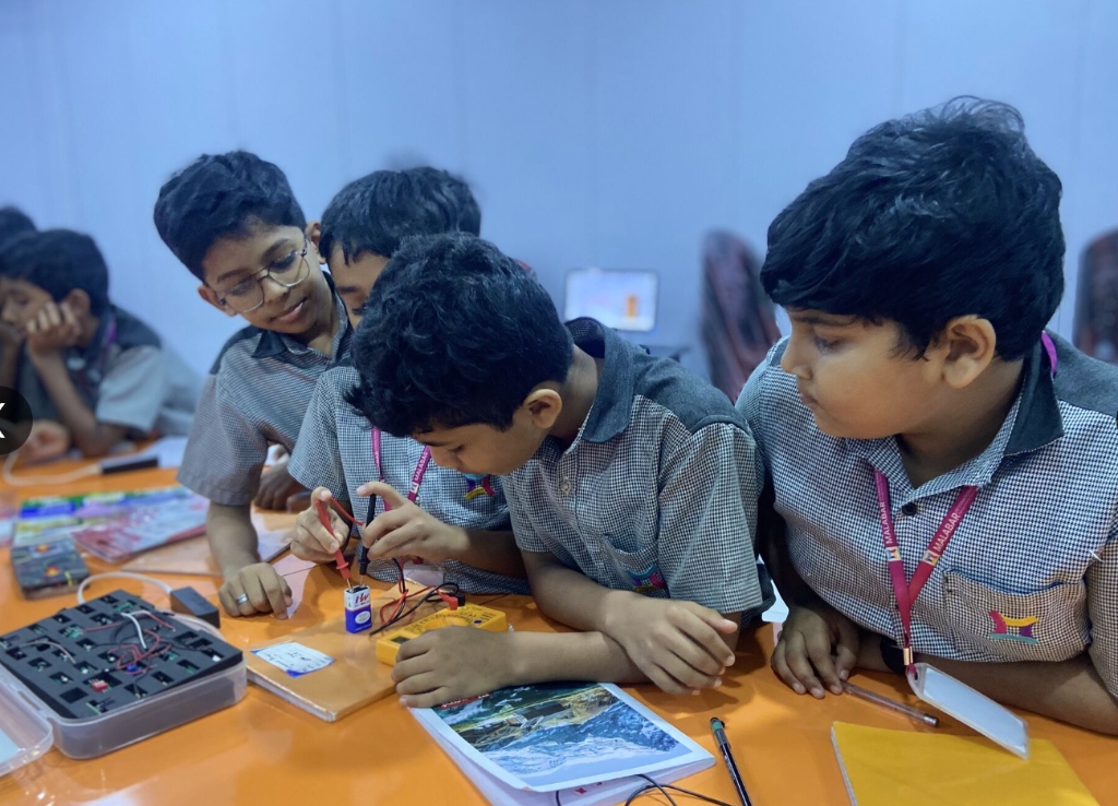 Students soldering electronics